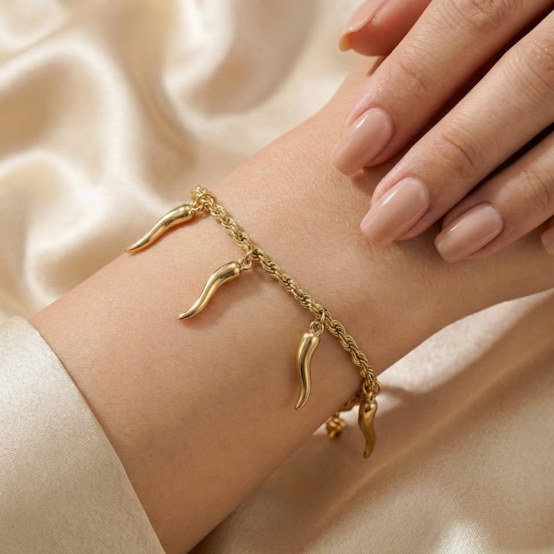 A stylish gold bracelet made of rust-resistant stainless steel, with a braided "rope" design from which attractive "pepper horn" pendants dangle, with an adjustable clasp to fit you. - Image 2